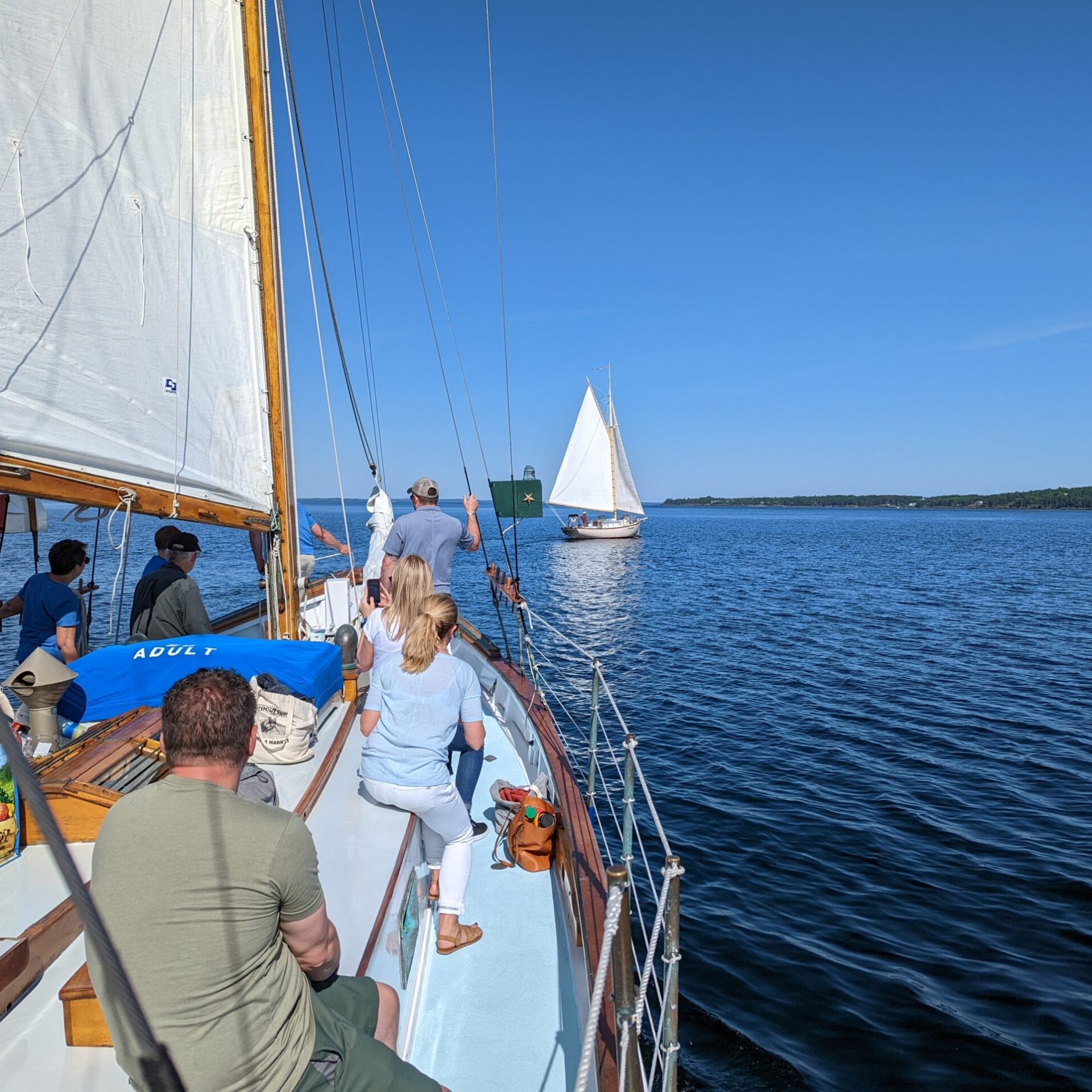 a group of people in a boat on a body of water