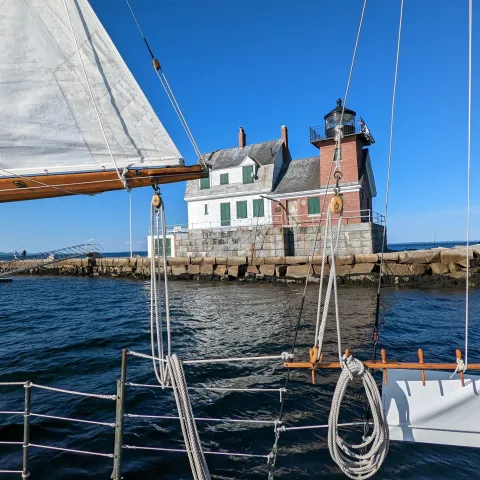 a boat is docked next to a body of water