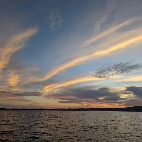 a sunset over a body of water
