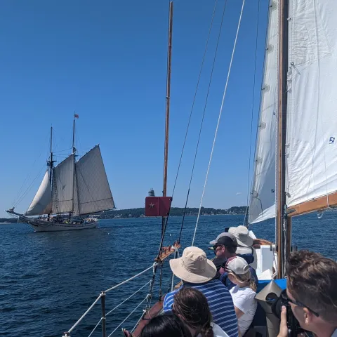 a group of people on a boat in the water