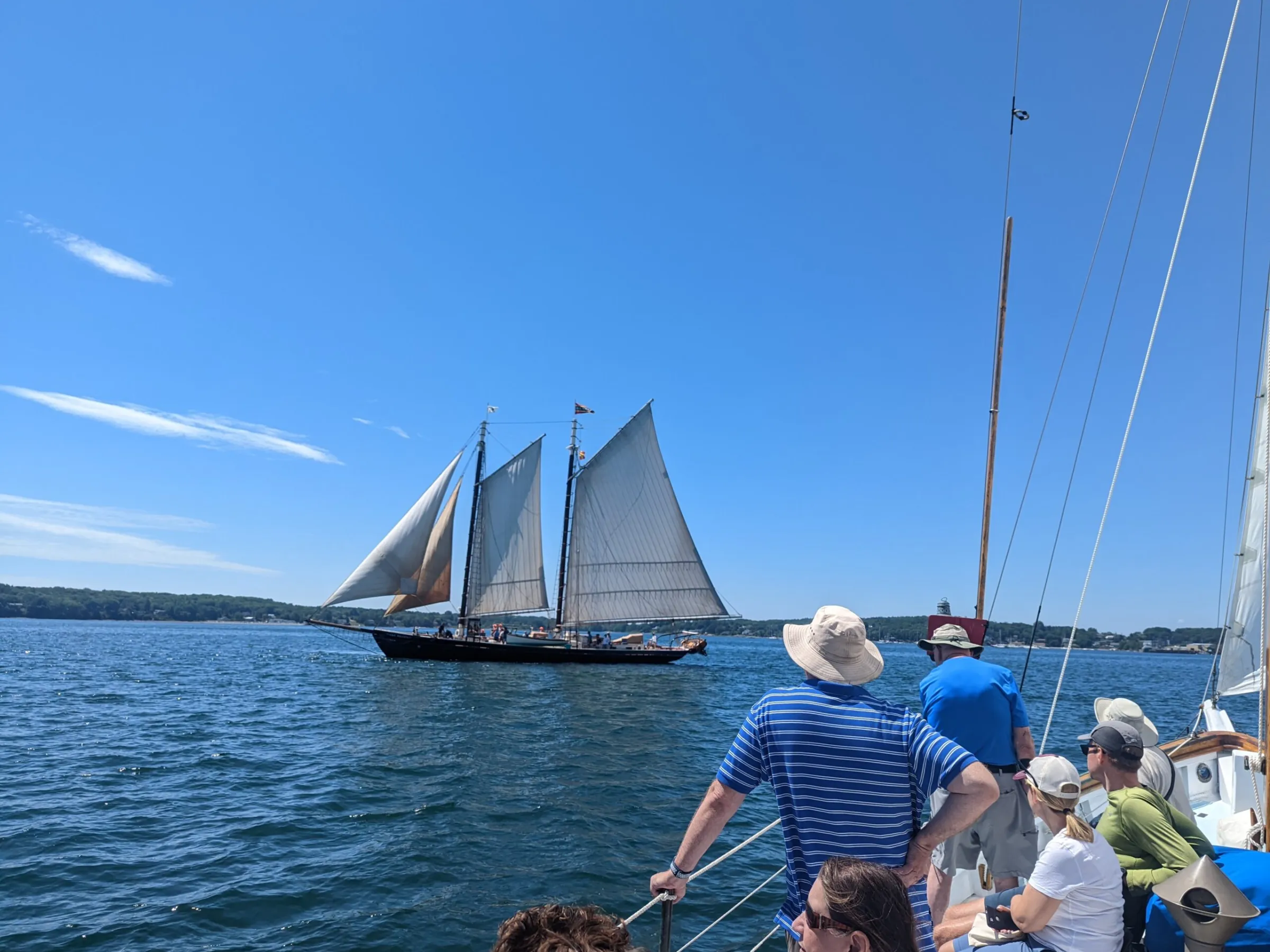 a group of people in a boat on a body of water