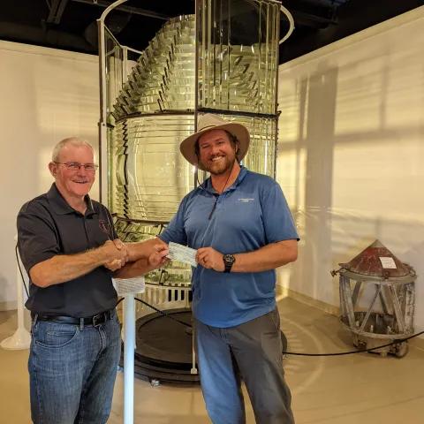 a man and a woman standing in front of a building