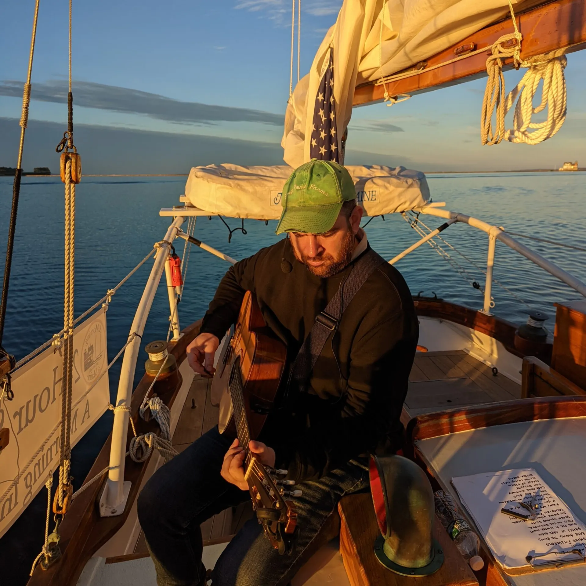 a man standing next to a body of water