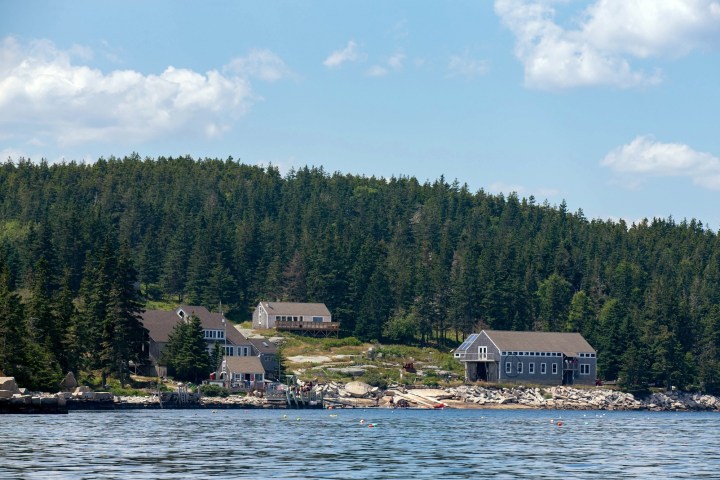 a large body of water with a mountain in the background