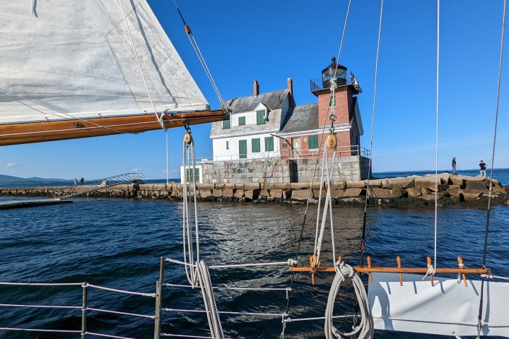a boat is docked next to a body of water